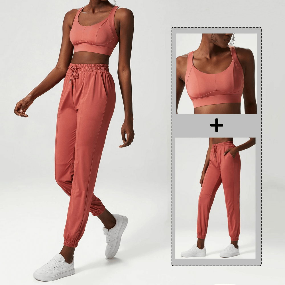 Woman wearing a stylish three-toned athletic clothing set, featuring a crop top and joggers, ideal for breathable, quick-drying performance.